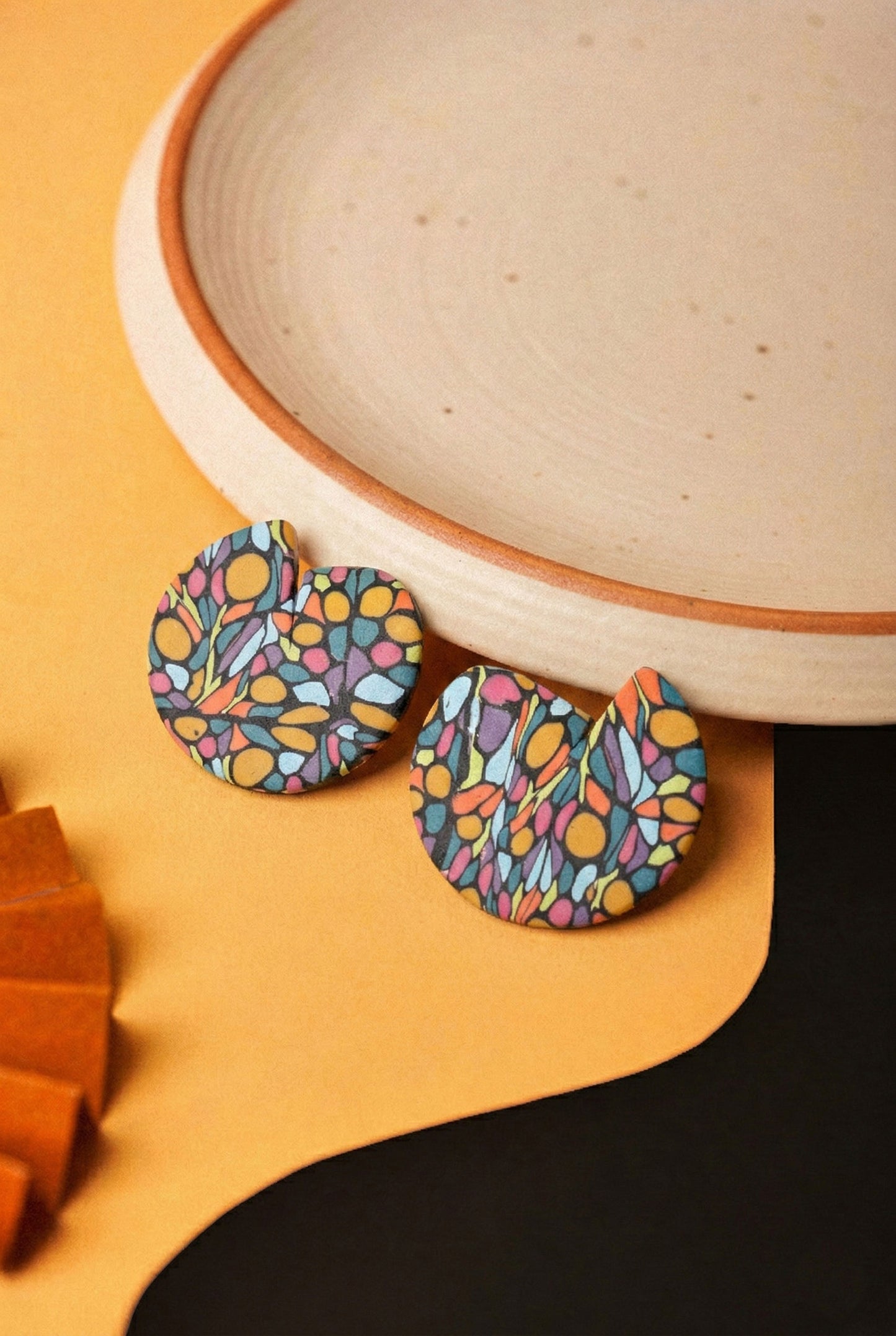 Oval drop earrings in a mosaic graffiti pattern. Lightweight and bold with a matte blue base.
