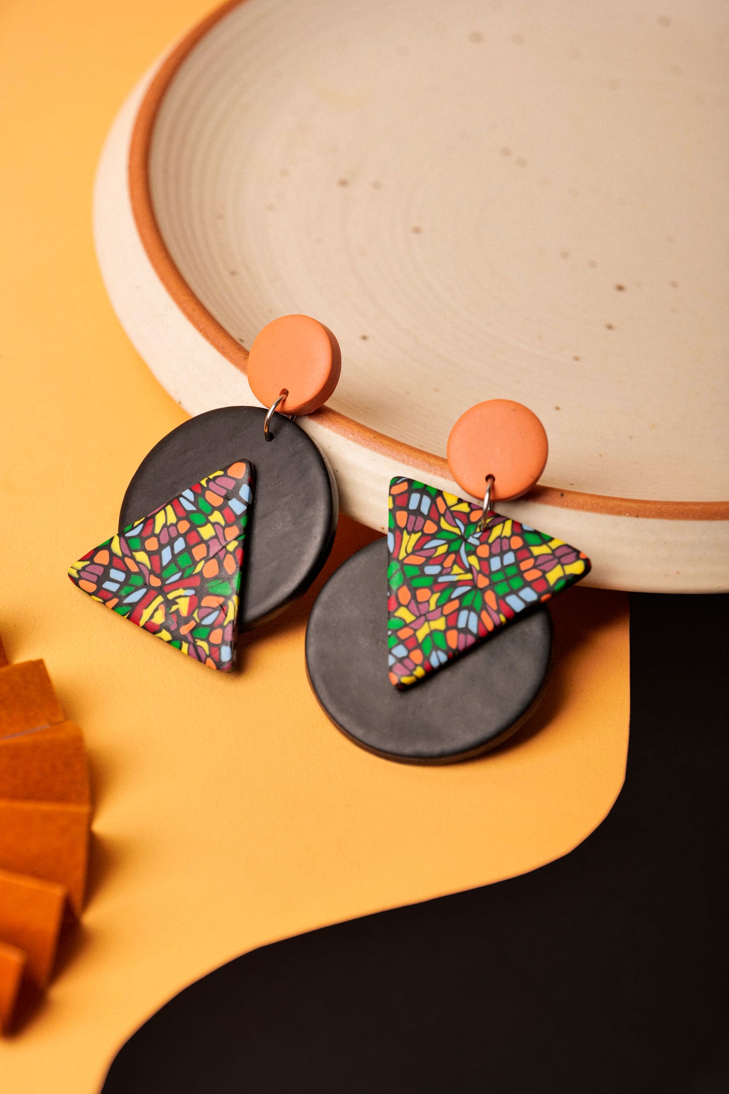 Triangle and circle drop earrings with bold contrast. Handmade mosaic pattern meets graphic form.