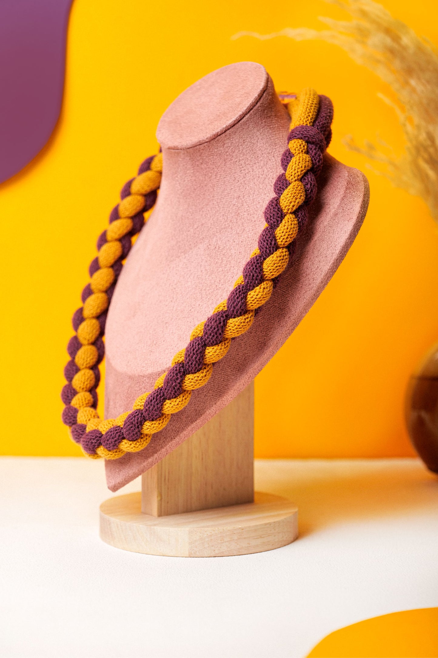 Braided textile necklace in deep red and mustard yellow. Lightweight statement for winter layering.