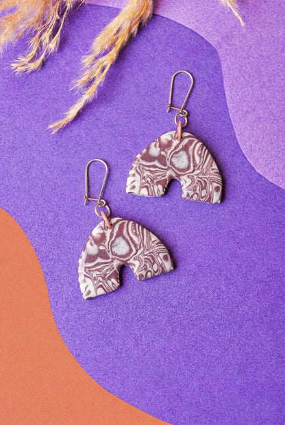 Marbled clay arches in a deep burgundy. Muted drama for everyday outfits.