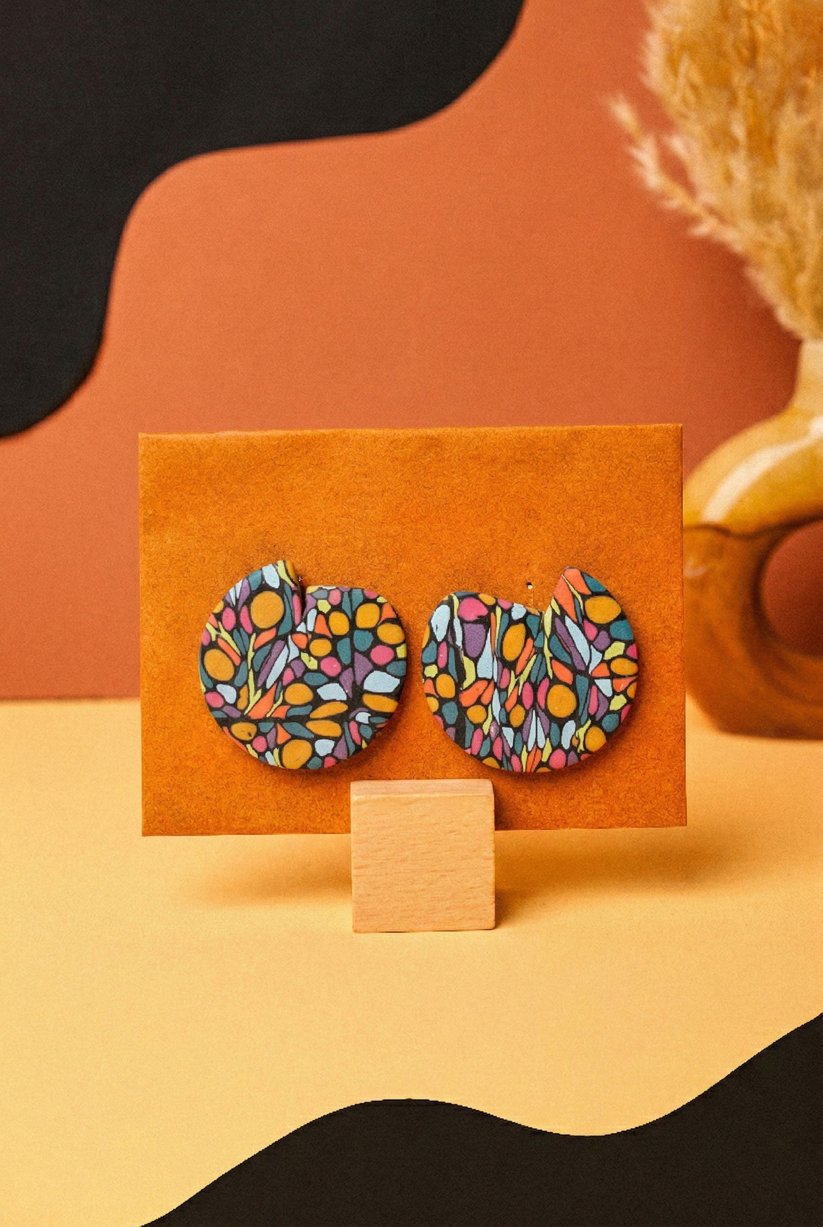 Oval drop earrings in a mosaic graffiti pattern. Lightweight and bold with a matte blue base.