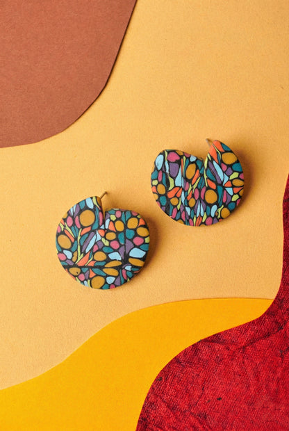 Oval drop earrings in a mosaic graffiti pattern. Lightweight and bold with a matte blue base.