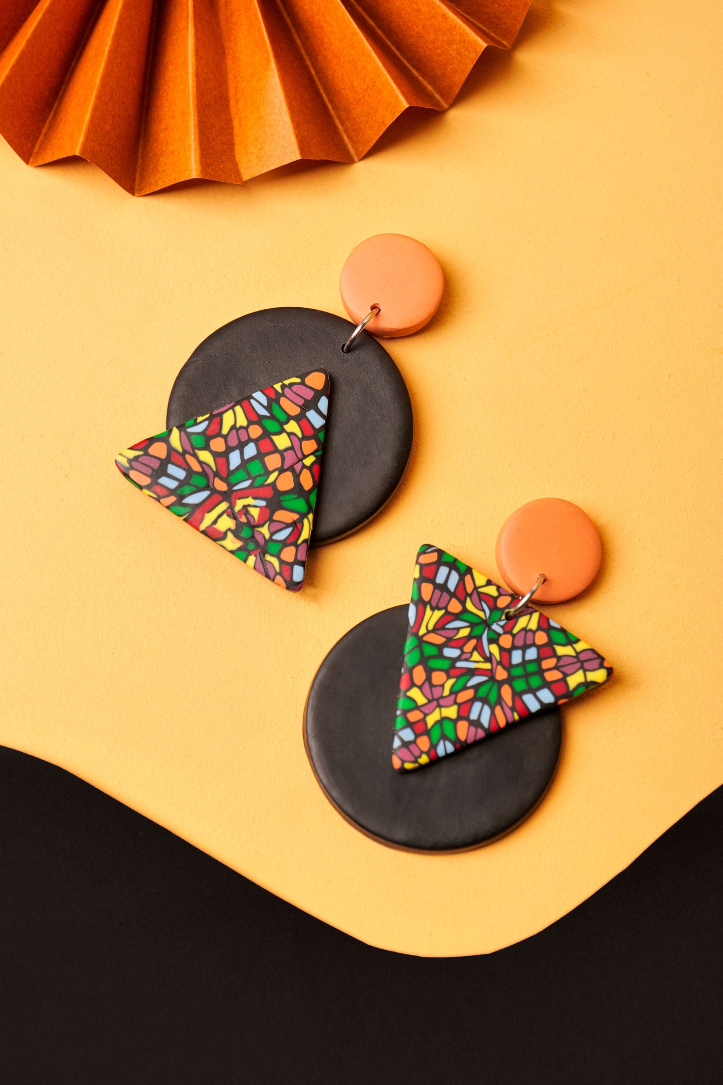 Triangle and circle drop earrings with bold contrast. Handmade mosaic pattern meets graphic form.