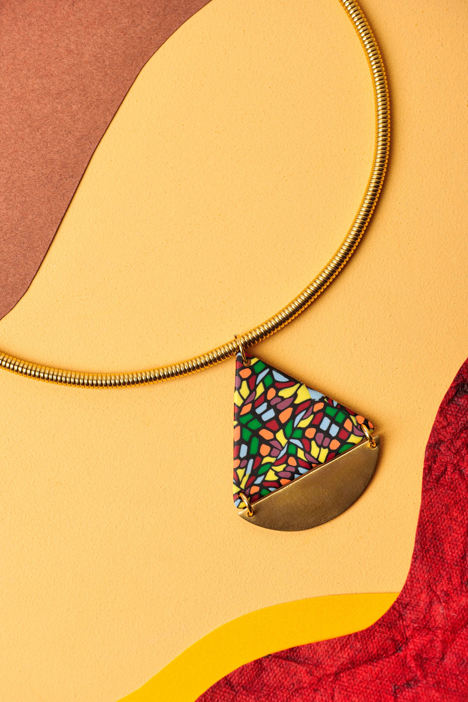Triangle necklace with mosaic pattern and gold detailing. Your showstopper piece.