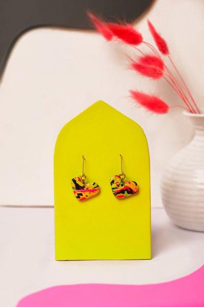 Neon clay with abstract flow. Small in shape, big in attitude.