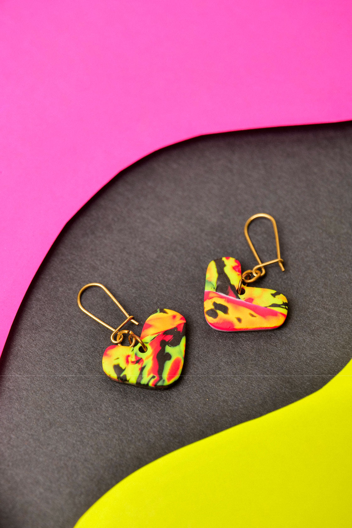 Neon clay with abstract flow. Small in shape, big in attitude.