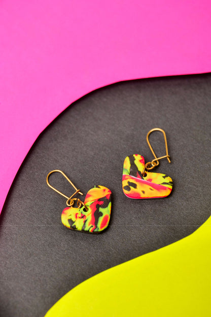 Neon clay with abstract flow. Small in shape, big in attitude.