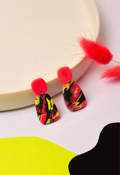 Neon swirl drop earrings in pink, lime and black. Lightweight, bold, and handmade in Berlin.