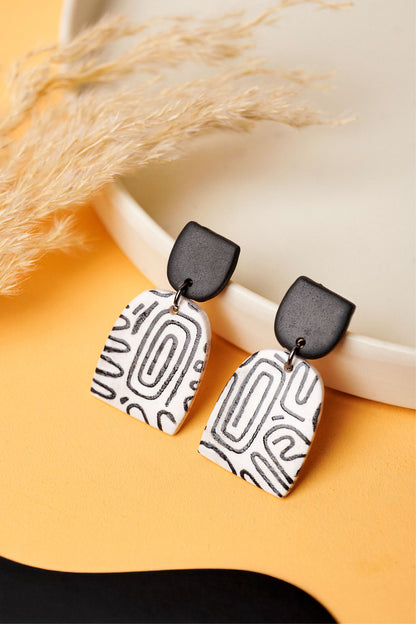 Black-on-white graffiti sketch earrings. Monochrome and graphic like the U-Bahn.