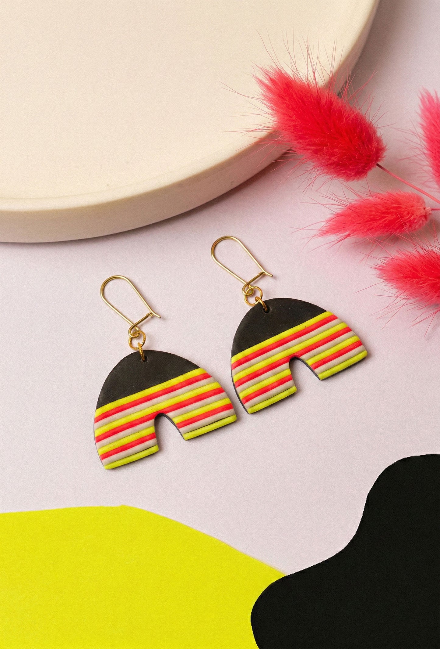 Neon striped clay arches for everyday party mode. Berlin colour, wearable shape.