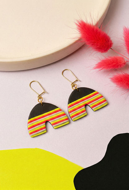 Neon striped clay arches for everyday party mode. Berlin colour, wearable shape.