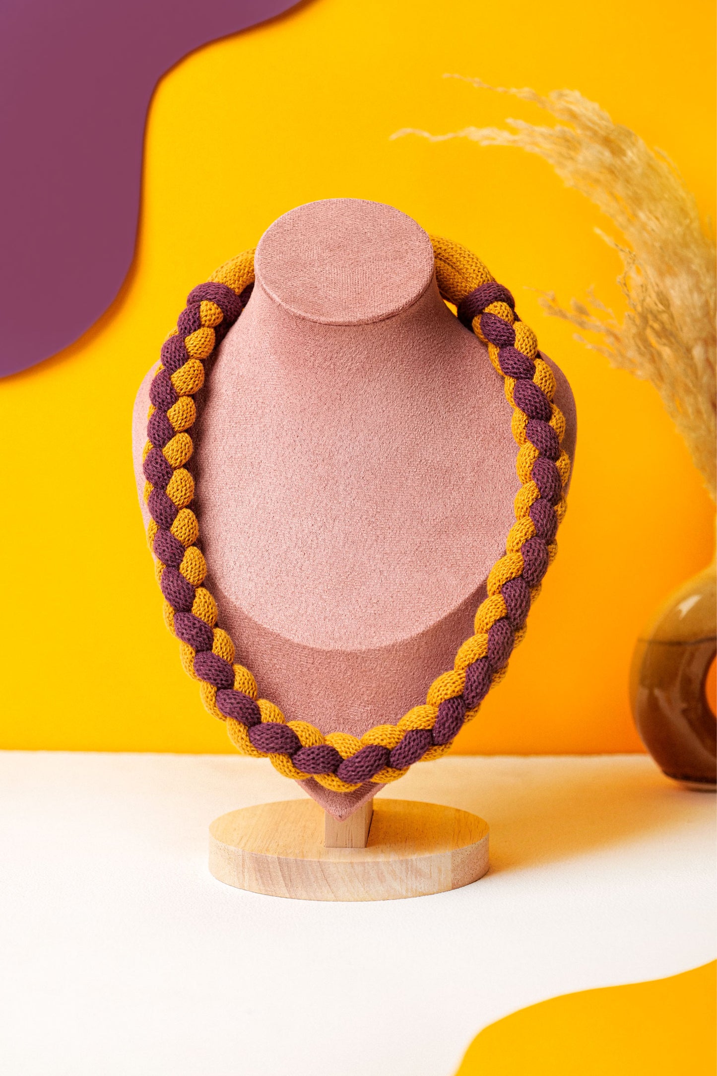 Braided textile necklace in deep red and mustard yellow. Lightweight statement for winter layering.