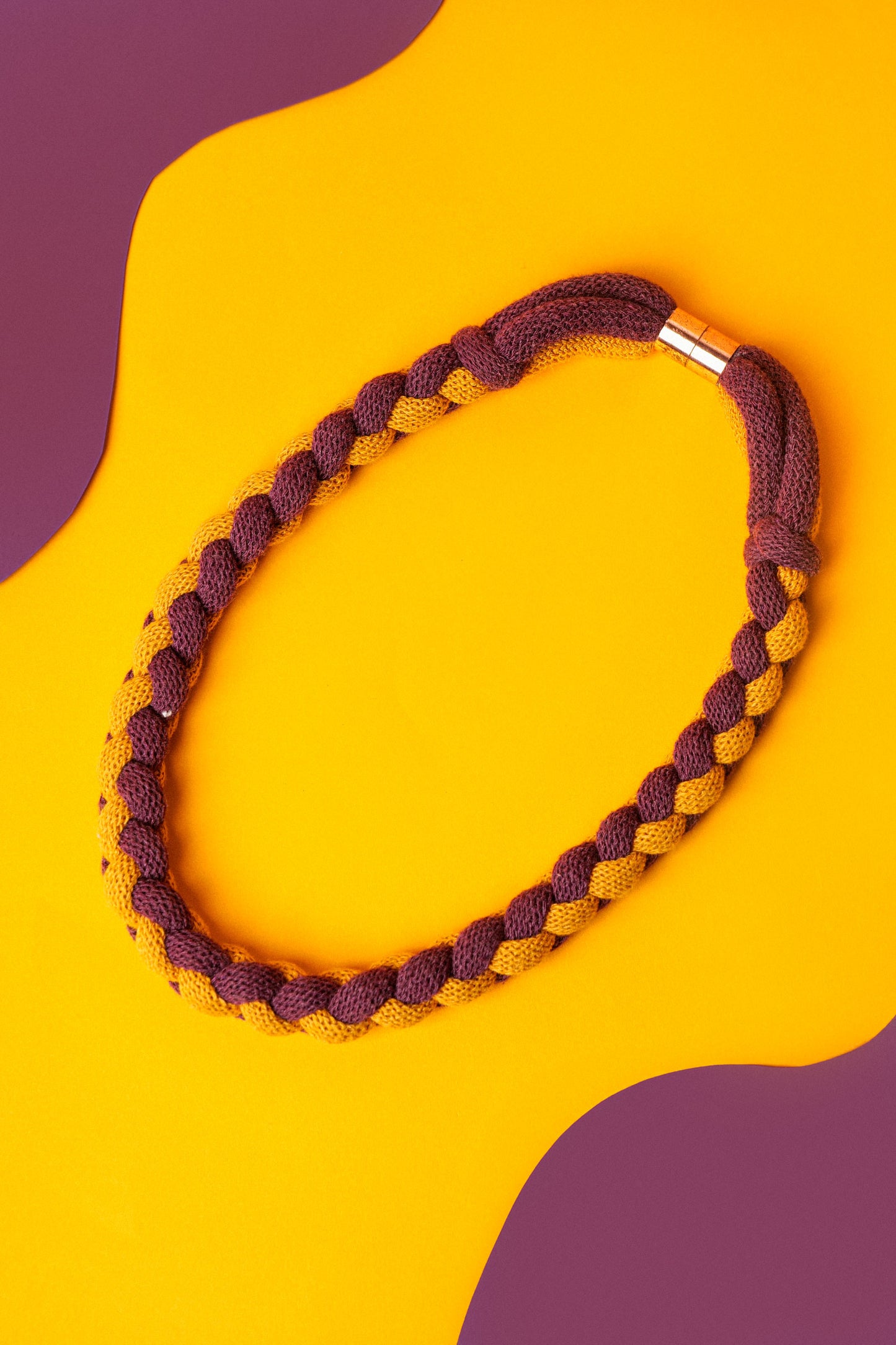 Braided textile necklace in deep red and mustard yellow. Lightweight statement for winter layering.