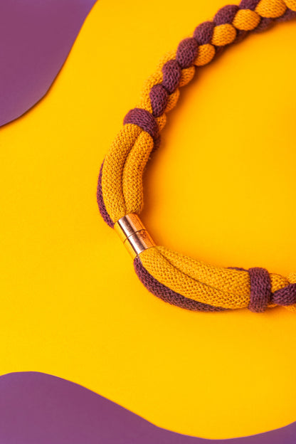 Braided textile necklace in deep red and mustard yellow. Lightweight statement for winter layering.